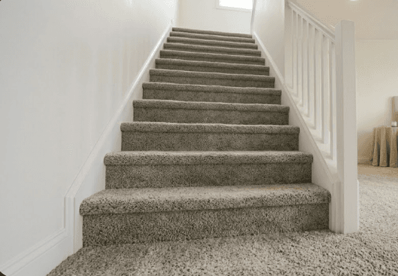 Custom stair carpet installation by 2020 Flooring with clean fitted runner-style finish