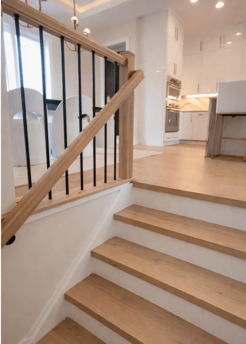 Custom hardwood staircase installation by 2020 Flooring with finished wood stair treads