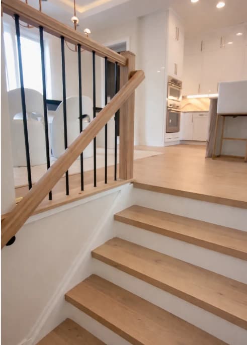 Custom hardwood staircase installation by 2020 Flooring with finished wood stair treads