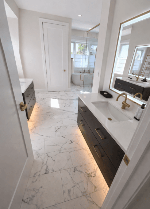 Custom Italian marble bathroom tile around vanity entrance installed by 2020 Flooring
