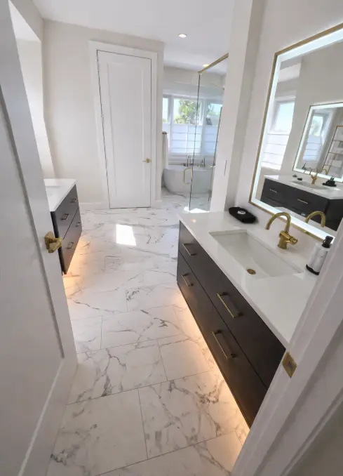 Custom Italian marble bathroom tile around vanity entrance installed by 2020 Flooring
