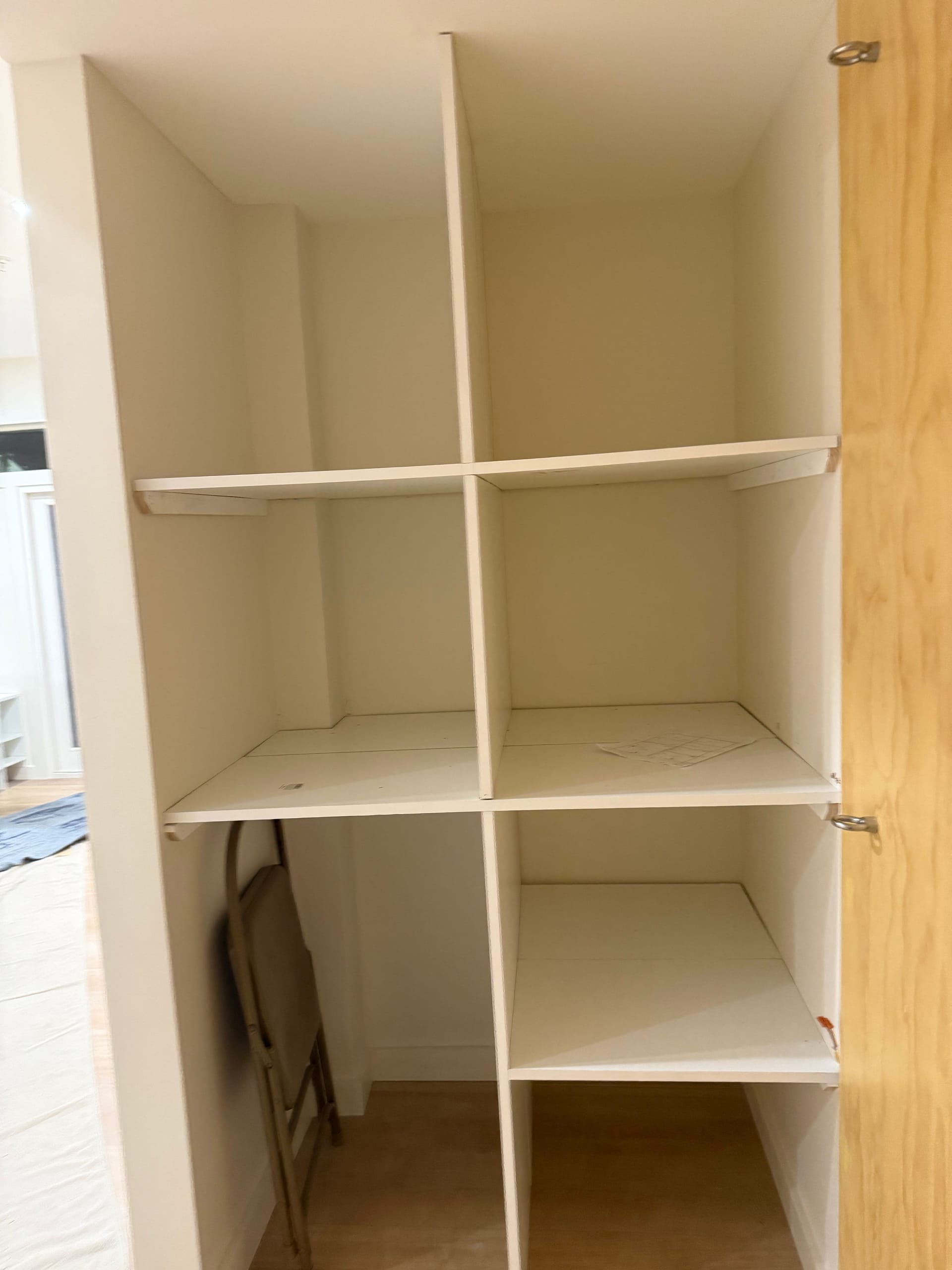 Custom built-in cubby storage for yoga mats, blocks, and studio accessories in a yoga studio remodel in Rockville, MD.