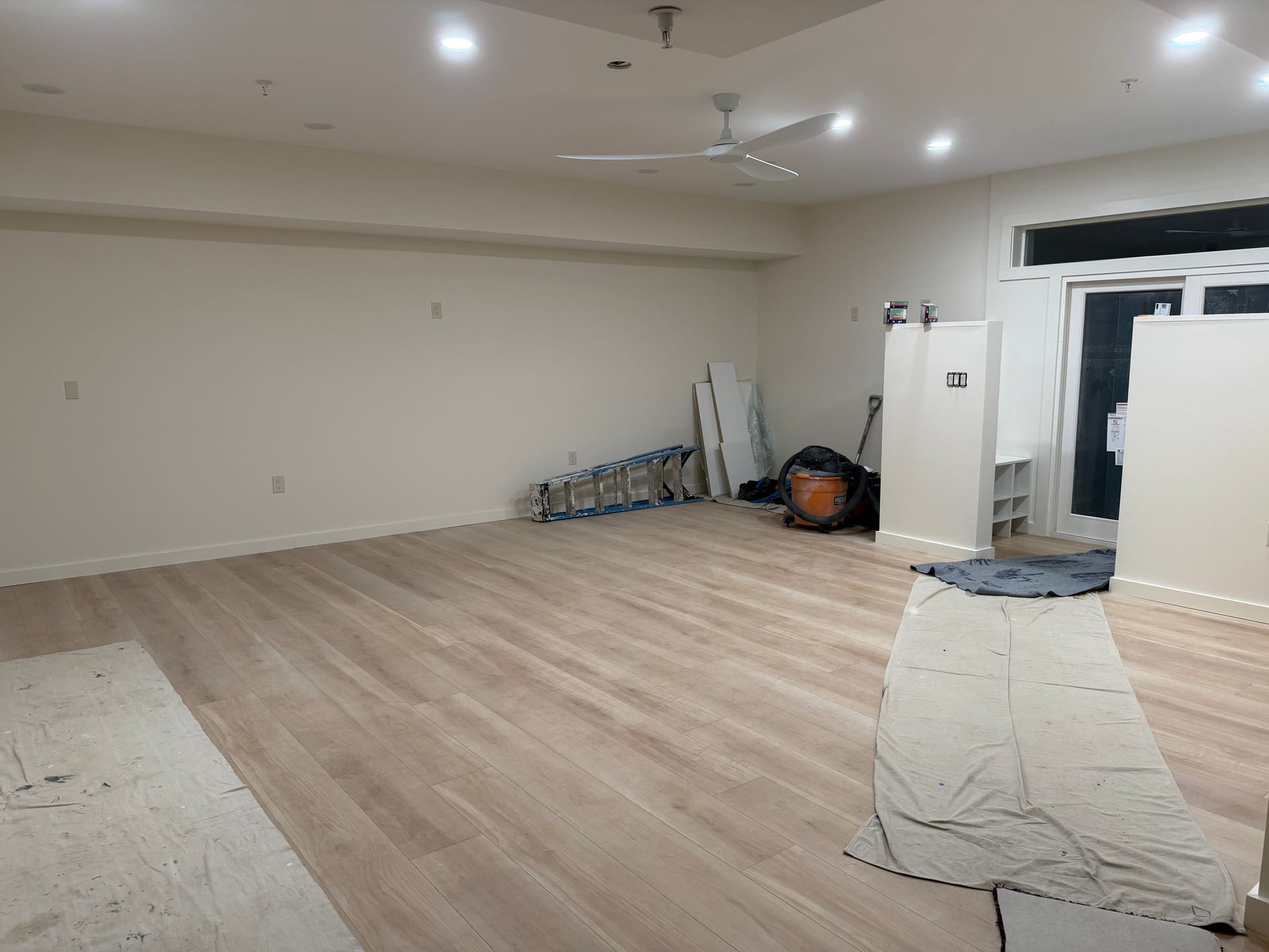 Before photo of laminate flooring installation in progress during a yoga studio remodeling project in Rockville, MD.