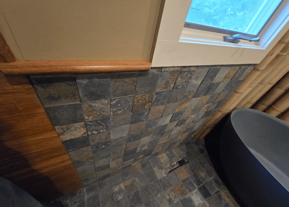 Close view of stone tile bathroom wall and floor in Fulton MD
