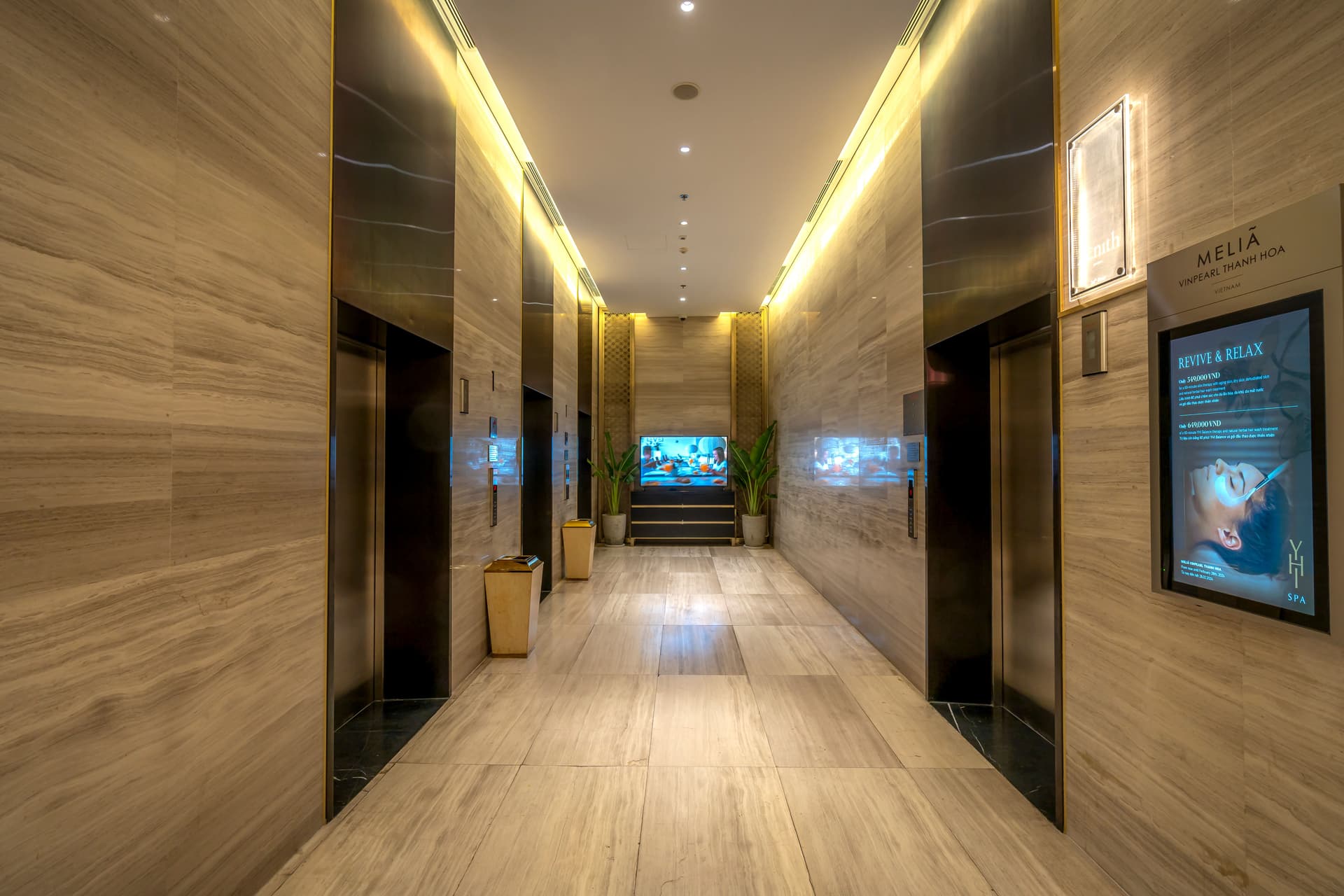 Wood-look luxury vinyl plank flooring in a hotel guest room — LVP is now the guest room default in most renovations